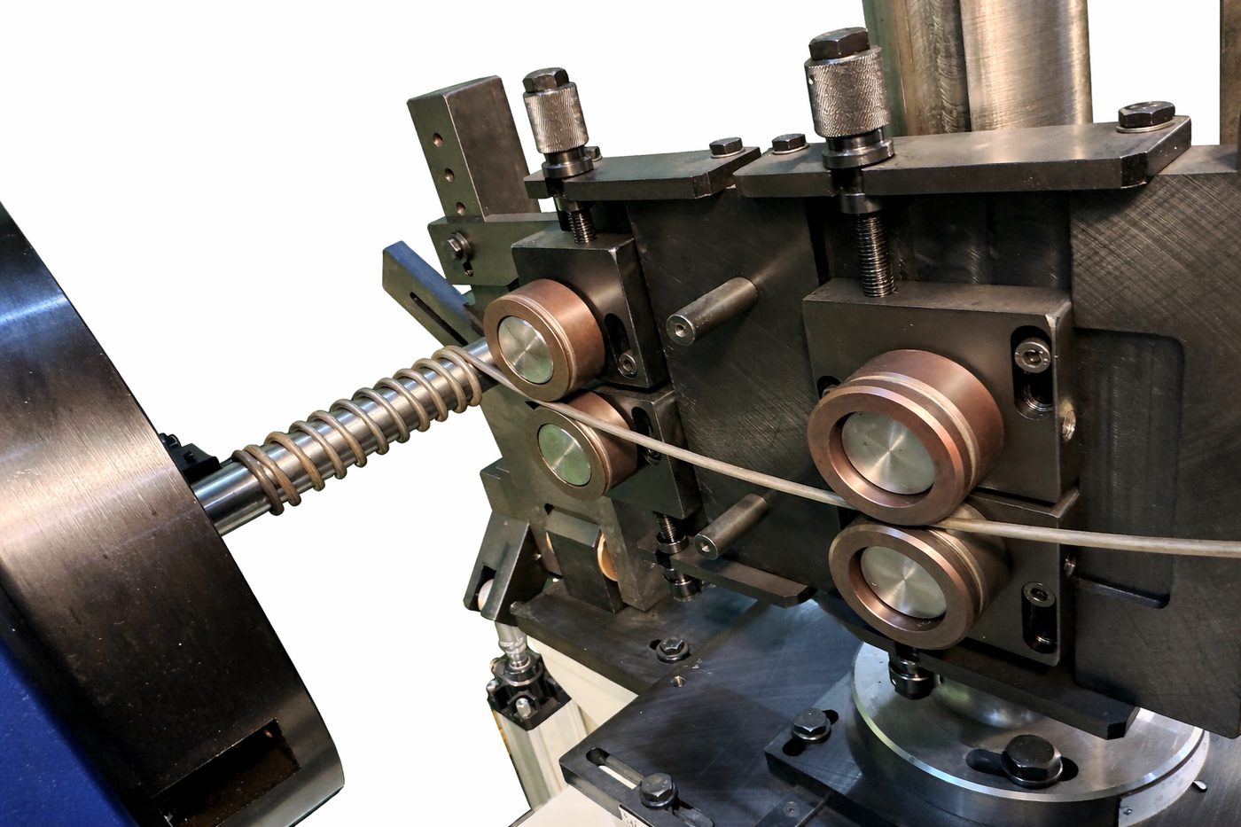 Wire being coiled into a spring on the Bennett MC-16